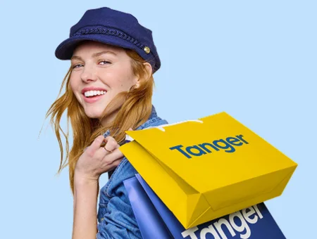 Woman carrying Tanger Outlets shopping bags Lancaster PA