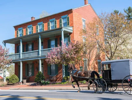 Amish horse and buggy passing Bird-in-Hand Village Inn and Suites, Lancaster PA