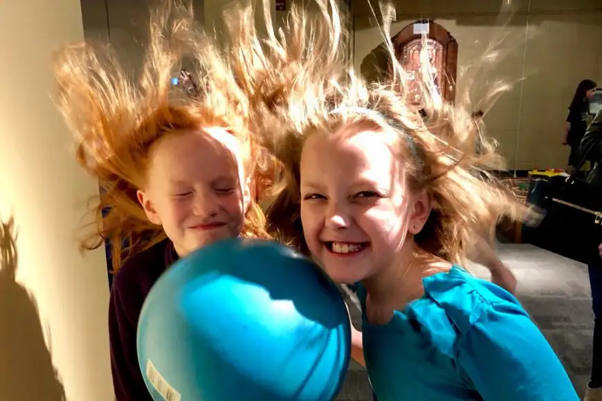 Kids laughing during a static electricity science experiment on a field trip at North Museum in Lancaster PA