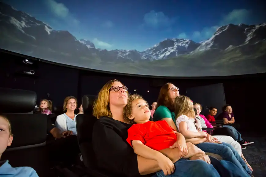 Families watching a planetarium show at North Museum of Nature and Science in Lancaster PA