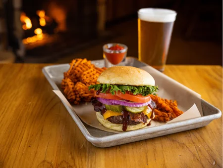 Cheeseburger with waffle fries and beer at Smokehouse at Plain & Fancy Farm in Lancaster PA