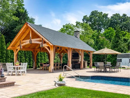 Custom timber frame pavilion with outdoor kitchen and inground pool by Fisher's Backyard Structures in Lancaster PA