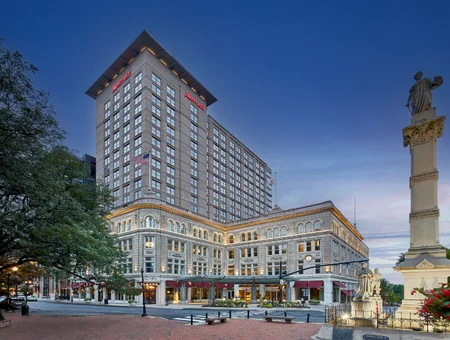 Lancaster Marriott at Penn Square exterior at dusk with a historic monument out front
