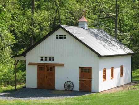 Custom white barn with copper cupola and wood doors by Heritage Buildings LLC in Lancaster PA