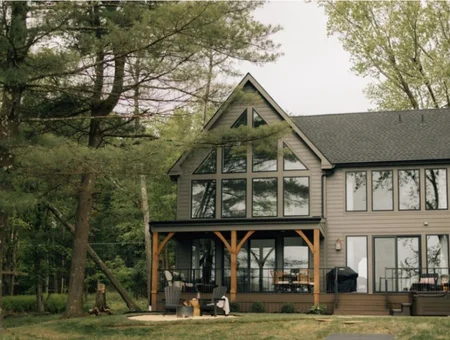 Exterior siding and roofing on modern lake house with floor-to-ceiling windows by King's Extreme Exteriors in Lancaster PA