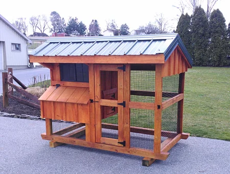 Sun Hill Barns custom wood chicken coop with metal roof and wire enclosure in Lancaster PA