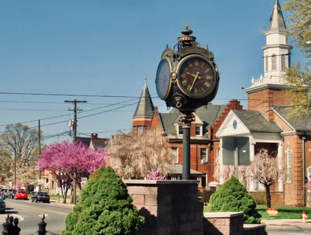 Historic street clock and church steeple in downtown Columbia PA Lancaster County
