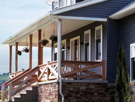 Premiere Building Products custom porch with wood railings and vinyl siding on home in Lancaster PA