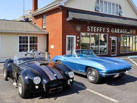 Steffys Garage classic car repair shop with vintage Cobra and Corvette in Lancaster PA