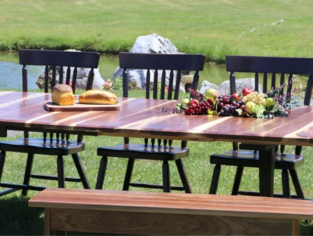 Handcrafted wooden dining table and chairs outdoors from George's Furniture in Lancaster PA