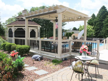 Custom pergola with retractable canopy attached to gazebo deck by poolside by Garbrella Pergolas in Lancaster PA