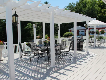 White vinyl pergola with lanterns over outdoor dining deck by Garbrella Pergolas in Lancaster PA