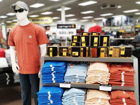Carhartt work clothing display with mannequin and folded shirts at Good's Store Lancaster PA