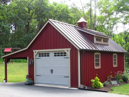 Red two-story storage barn with metal roof and garage door from EZ Storage Barns in Lancaster PA