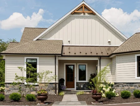 Custom built craftsman style home entrance with stone accents and covered porch by Forest Ridge Builders in Lancaster PA