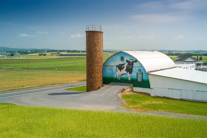 Barn with dairy cow mural and silo at Kreider Farms in Lancaster PA