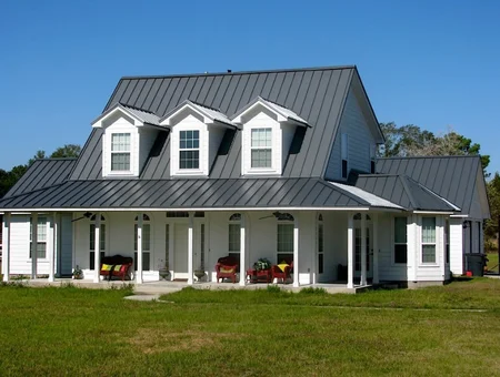 Superior Roofing gray standing seam metal roof on farmhouse with front porch in Lancaster PA