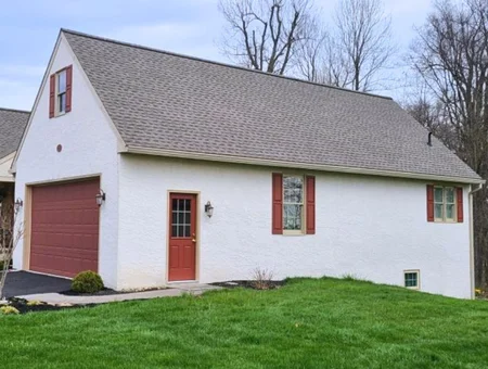 Triple Pine Roofing shingle roof replacement on white stucco garage and home in Lancaster PA
