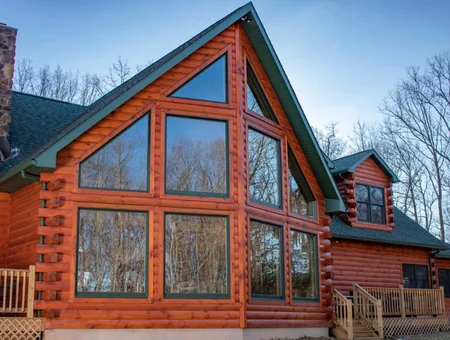 Custom log home with large peaked window wall built by Gingrich Builders in Lancaster County PA