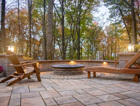 Willow Gates Home and Landscape stone patio with circular fire pit and Adirondack chairs in Lancaster PA