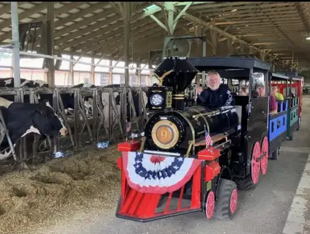 Barnyard Express miniature train ride through the dairy barn at Oregon Dairy Farmstead in Lancaster PA