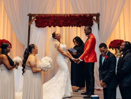 Weddings at Penn Square wedding ceremony under floral arch with bridal party in Lancaster PA