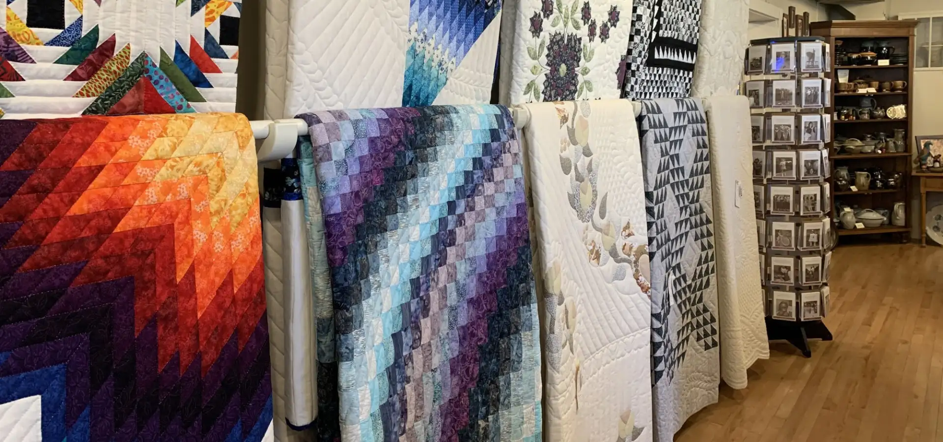 Colorful handmade Amish quilts on display at Old Country Store in Lancaster County PA