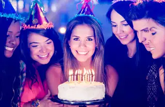 Group of adults celebrating a birthday with cake at a Lancaster PA amusement park