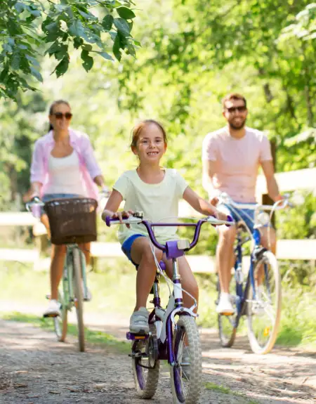 Family biking together on a scenic trail in Lancaster County PA