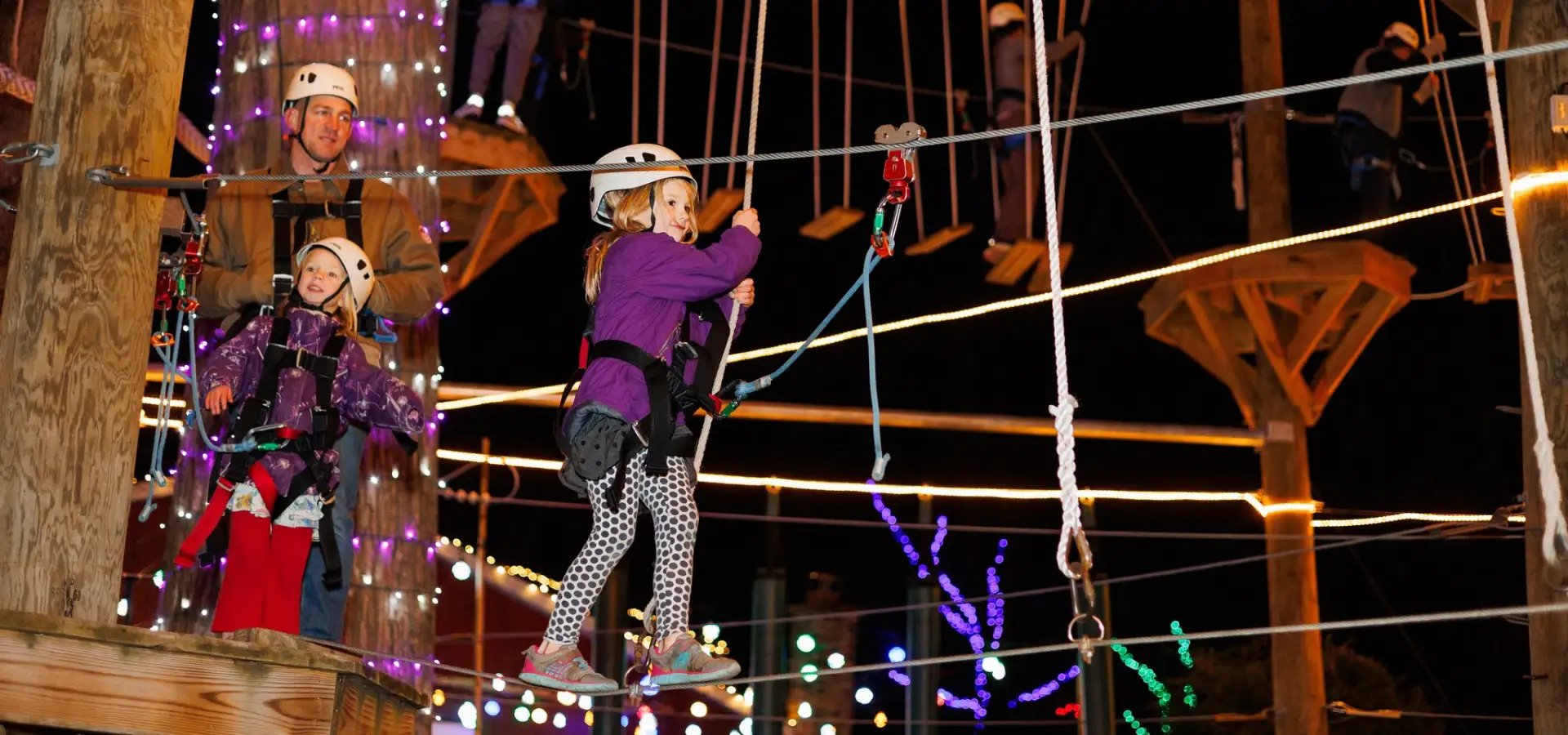 Kids on a Christmas light-decorated ropes course at Refreshing Mountain in Lancaster PA