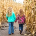 Two kids walking through a corn maze at Cherry Crest Adventure Farm in Lancaster County PA