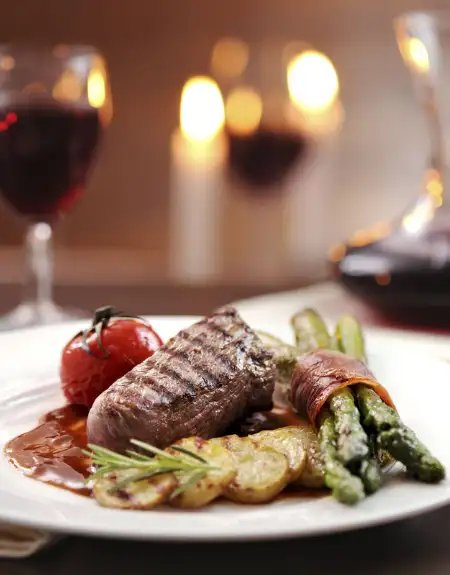 Dutch Apple Dinner Theatre dinner entree steak and asparagus with red wine - Lancaster PA