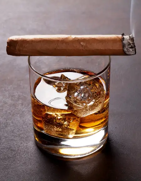Whiskey on the rocks with a cigar at a Lancaster County PA distillery tasting experience