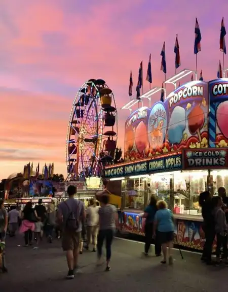 Ferris wheel and carnival food vendors at sunset at the Ephrata Fair in Lancaster County PA