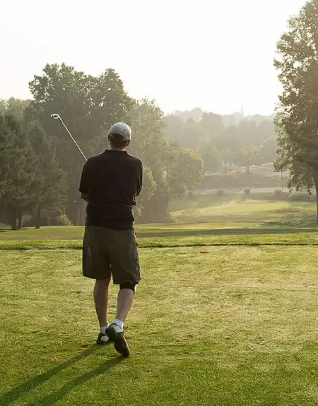 Golfer teeing off on a misty morning at Willow Valley Golf Course in Lancaster PA