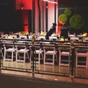 Private group dining event setup with red ambient lighting at Per Diem Hotel in Lititz Lancaster County PA