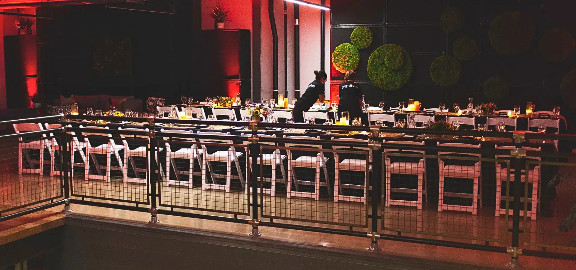 Private group dining event setup with red ambient lighting at Per Diem Hotel in Lititz Lancaster County PA