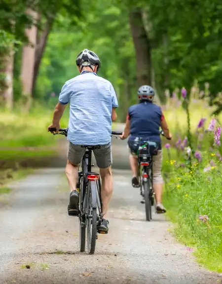 Two cyclists riding bikes on a scenic trail in Lancaster County PA
