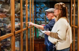 Couple viewing exhibits in a display case at a Lancaster PA museum