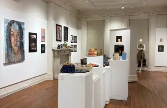 Art gallery interior with paintings and sculptures on display in Lancaster PA