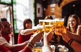 Friends toasting with beer at a Lancaster PA brewery