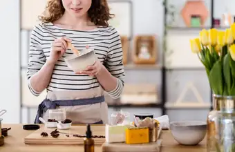 Woman mixing ingredients at an indoor cooking or craft class in Lancaster PA