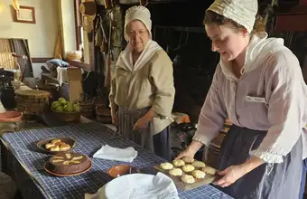 Colonial-era women preparing food at a Lancaster PA historical site