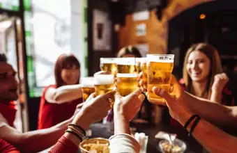 Friends toasting with beer at a Lancaster PA brewery