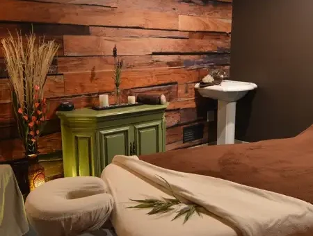 Relaxing massage room with reclaimed wood walls at Body and Sole spa in Lancaster County PA