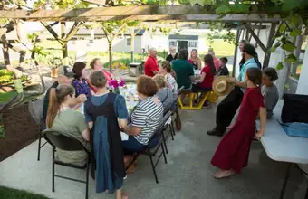 Amish Farm and House outdoor group meal experience with visitors - Lancaster PA Amish country tour