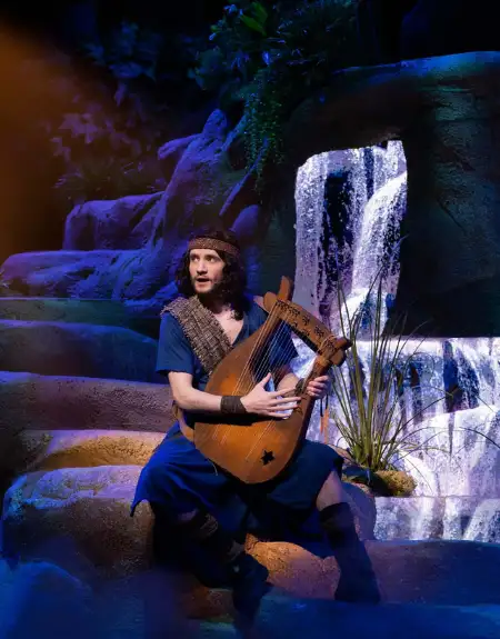 Biblical stage performance with actor playing harp at Sight and Sound Theatres in Strasburg Lancaster County PA