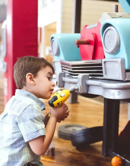 Young child playing at Tiny Town kids interactive play center in Lancaster PA