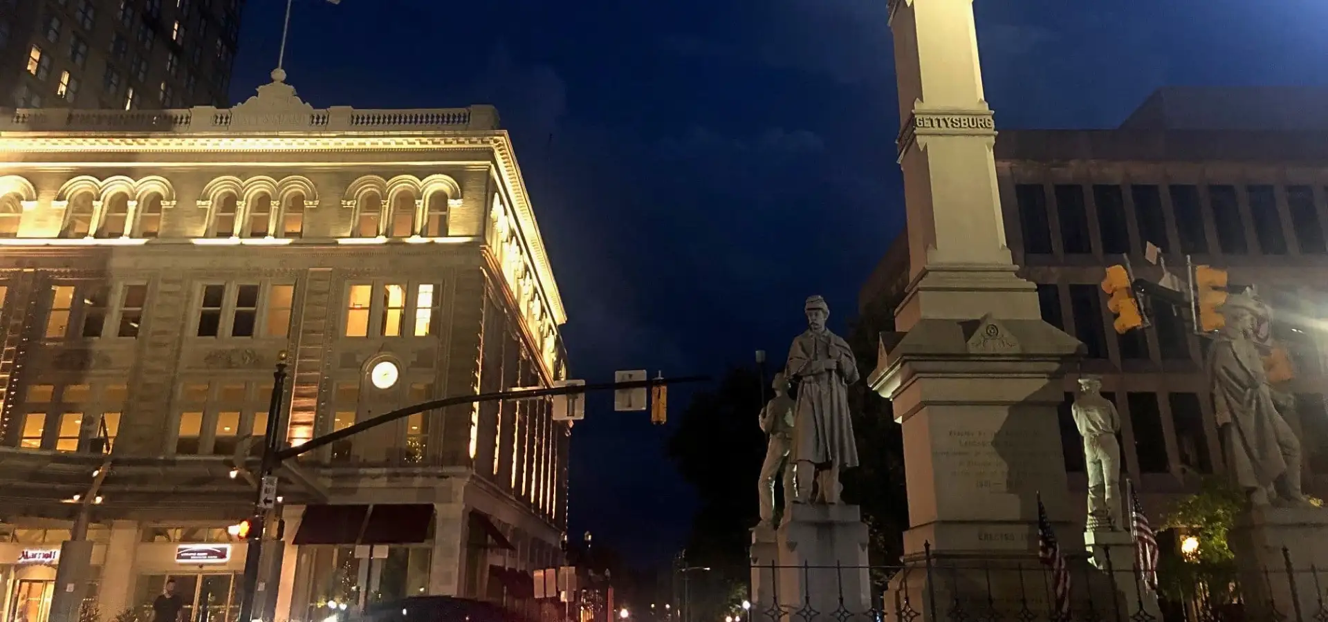 Lancaster PA downtown at night with Civil War monuments lit up on Penn Square
