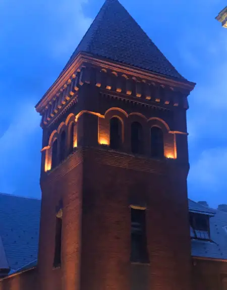 Historic brick tower lit up at night on a Lancaster City PA ghost tour